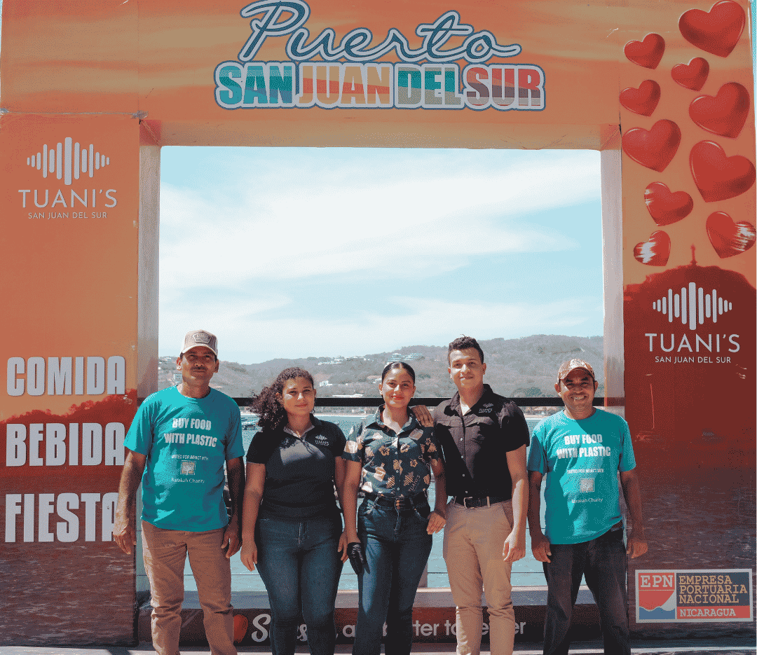 Photo of the Tuani's team and Buy Food with Plastic team collaborating together for a cleaner environment 
