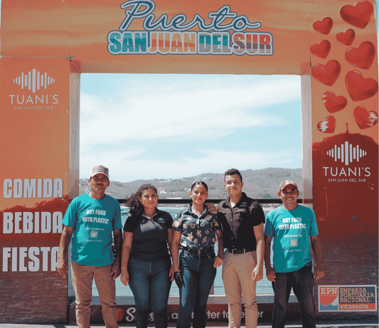 Photo of the Tuani's team and Buy Food with Plastic team collaborating together for a cleaner environment 